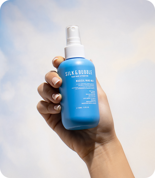 Silk and bubble Your Mane Attraction Magical Mane Mist bottle, containing a luxurious mist that revitalizes and nourishes hair
