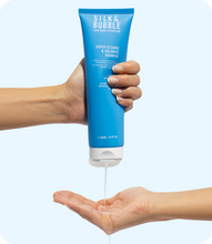Load image into Gallery viewer, Silk and bubble Super Cleanse and Volumise Shampoo being poured into the palm of a hand